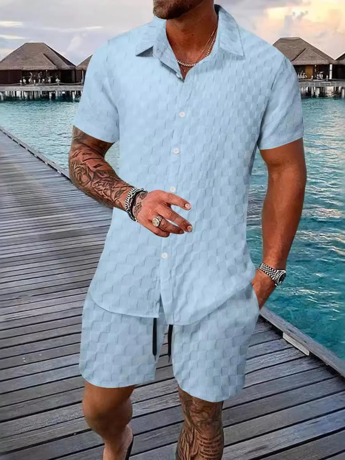 Plus size man wearing collared short sleeve top and shorts set