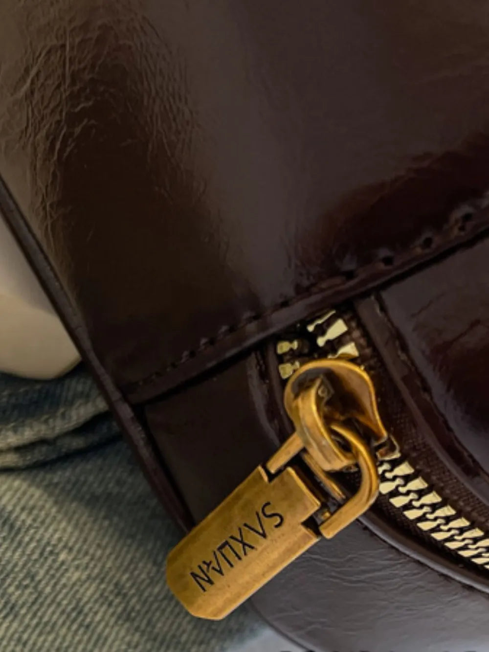 Close-up of bow trim handbag