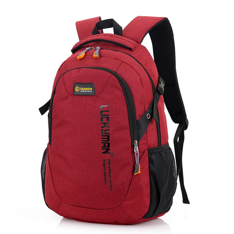 Laptop and school supplies in backpack