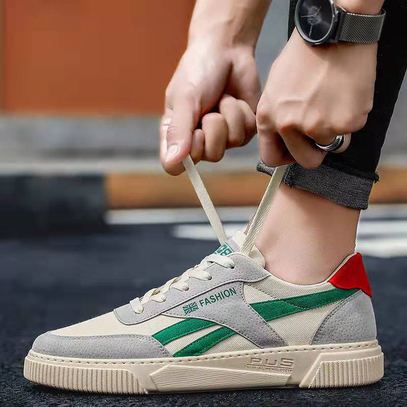 Trendy men’s canvas sports shoes with grey, cream, and green design