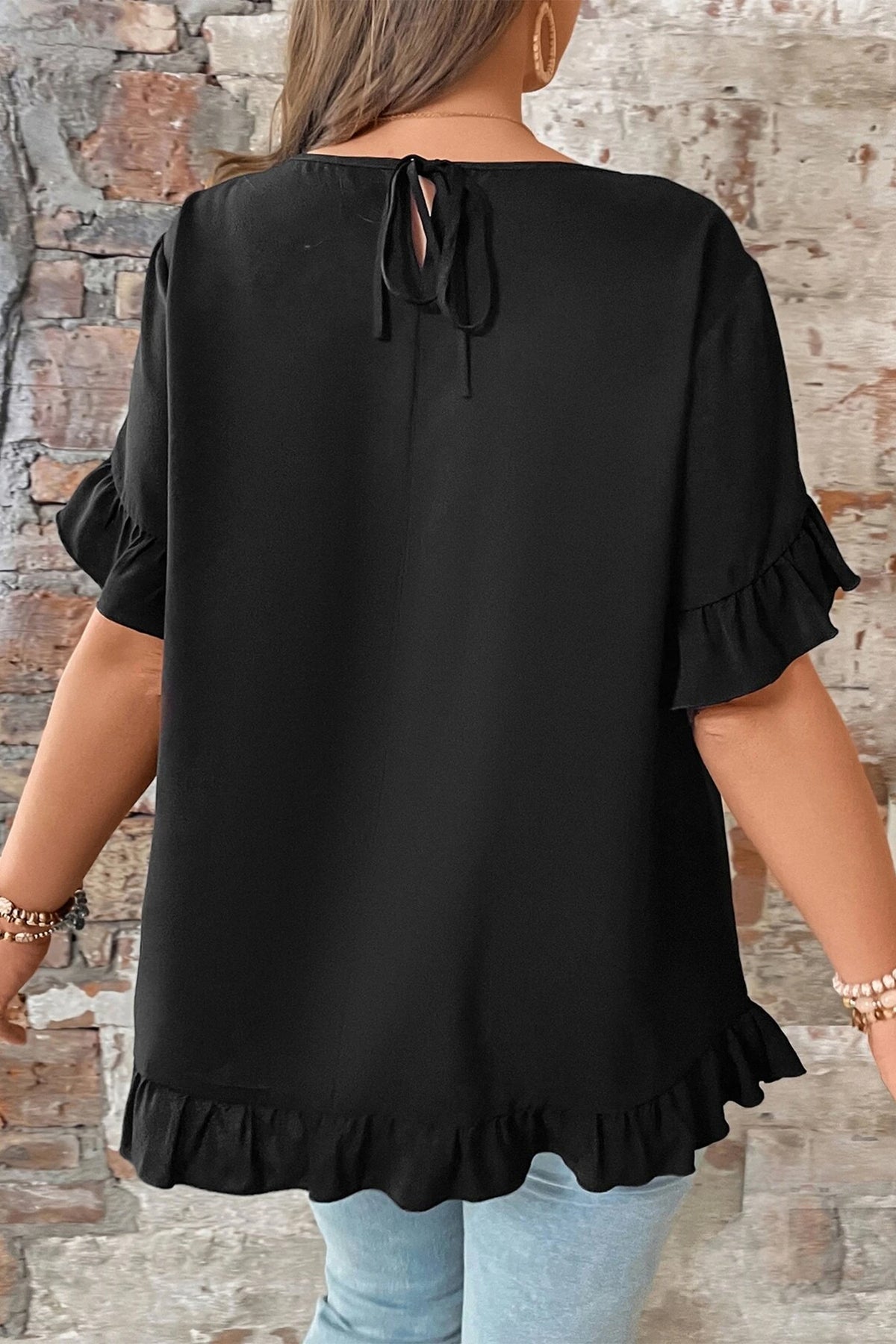 Women's plus size black ruffle trim petal sleeve casual loose fit top back view with keyhole tie detail