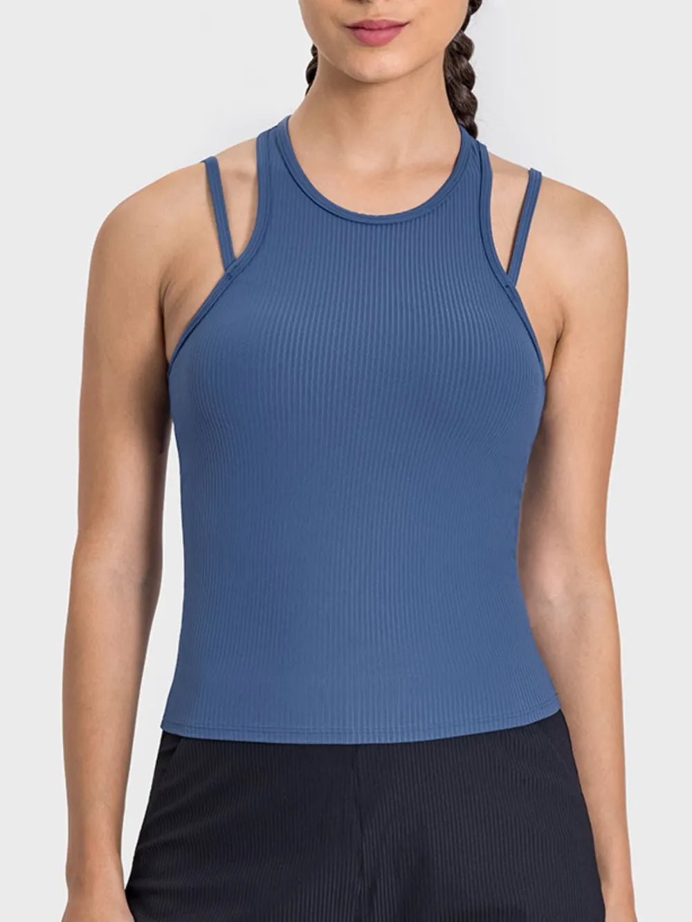 "Form-fitting ribbed tank in soft taupe color with stylish dual-strap detail and round neckline, ideal for athletic or casual wear."
