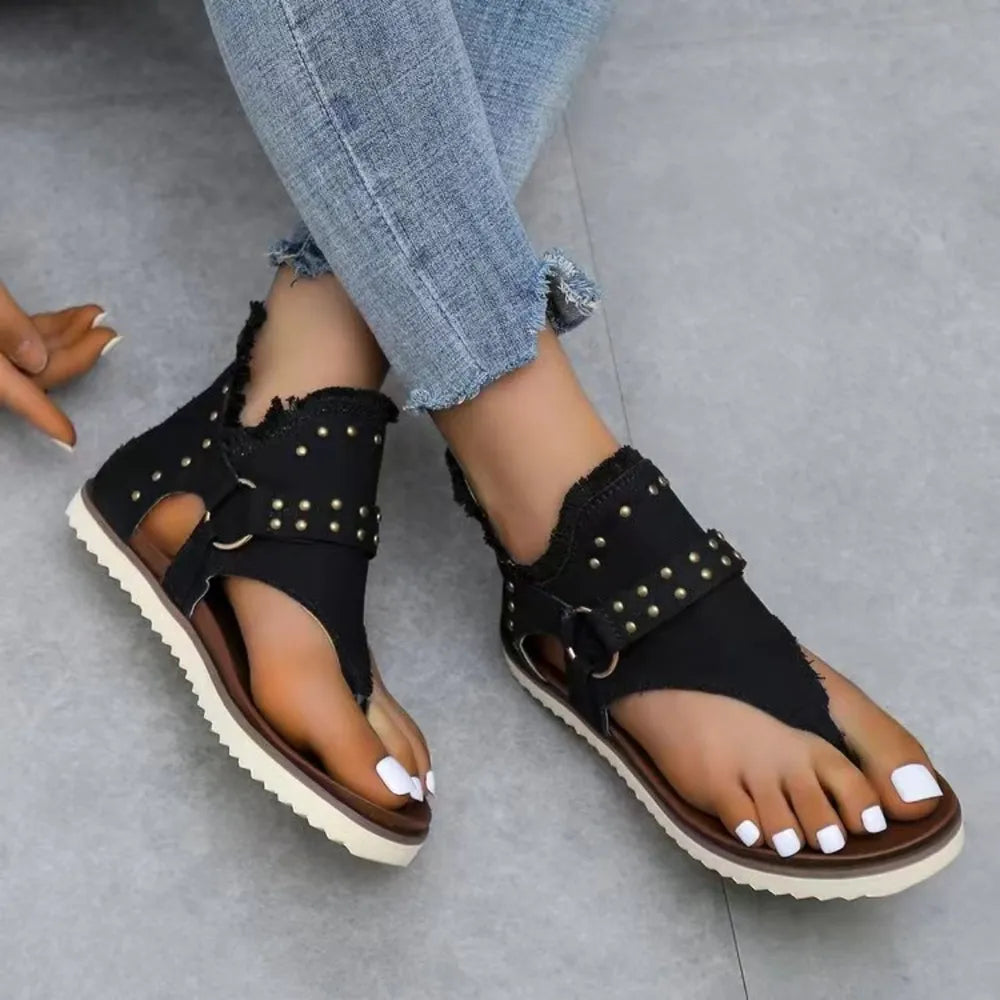 Sandals with raw trim and metal studs

