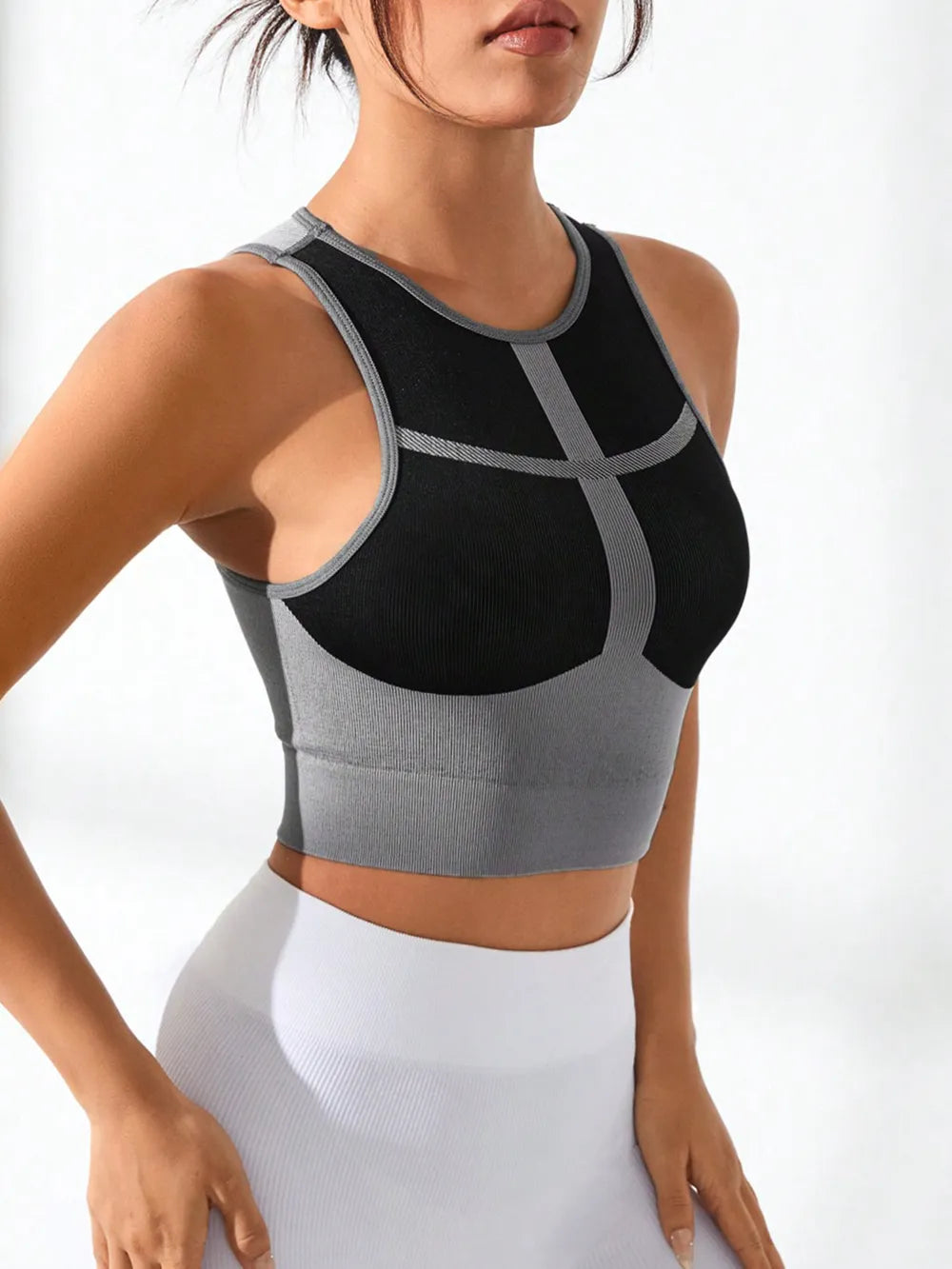 Fitness model in active tank top during stretching

