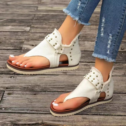 Side view of studded flat summer shoes

