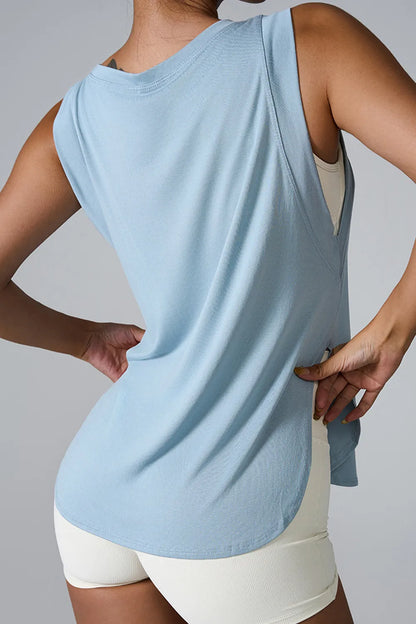 "Breathable white sleeveless top designed for comfort during exercise"

