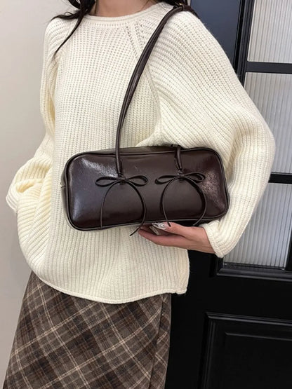 Crossbody bag with bow accent

