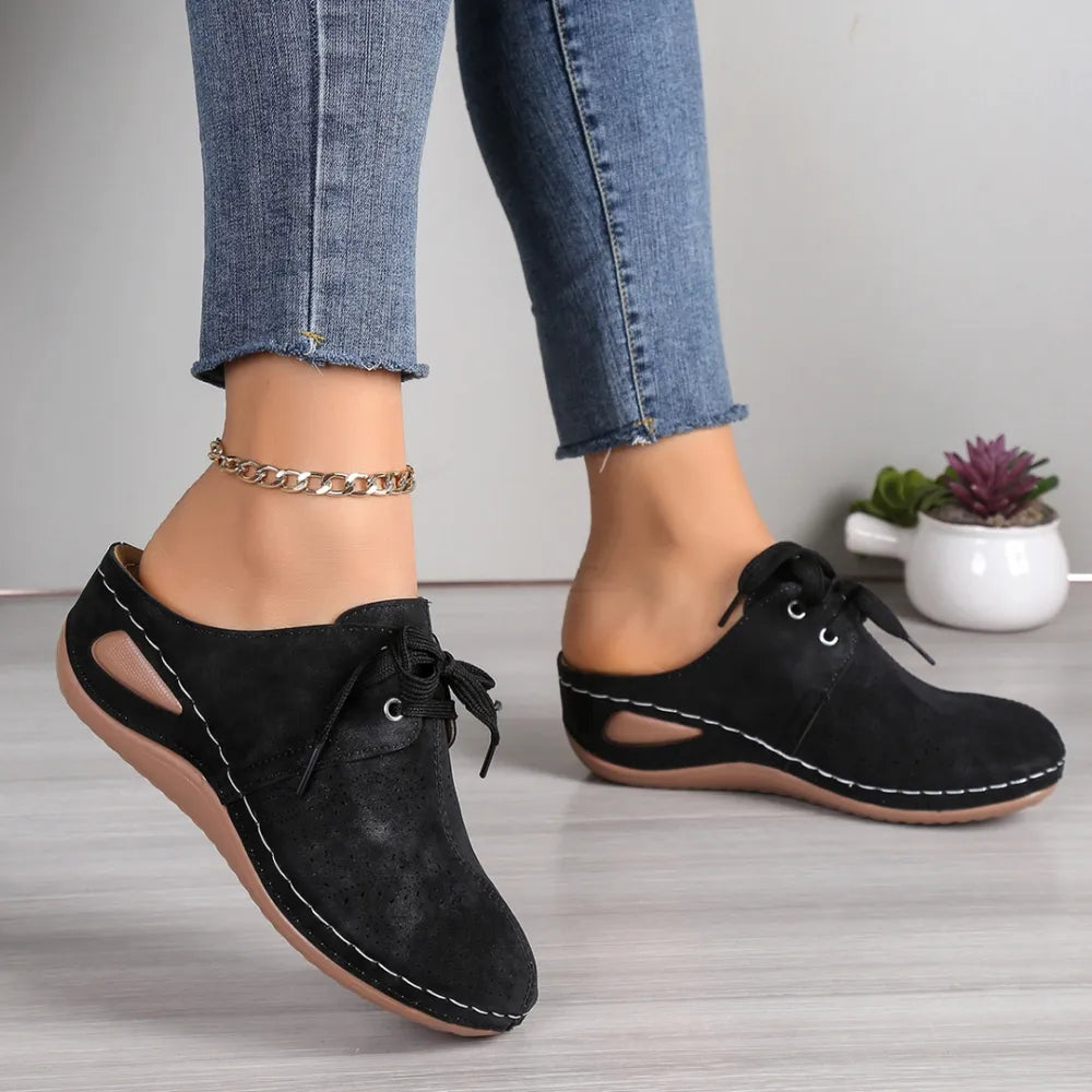 Side view of lace-up wedge shoes

