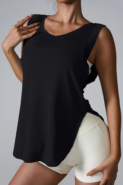 "Minimalist white athletic tank with relaxed fit and olive leggings"
