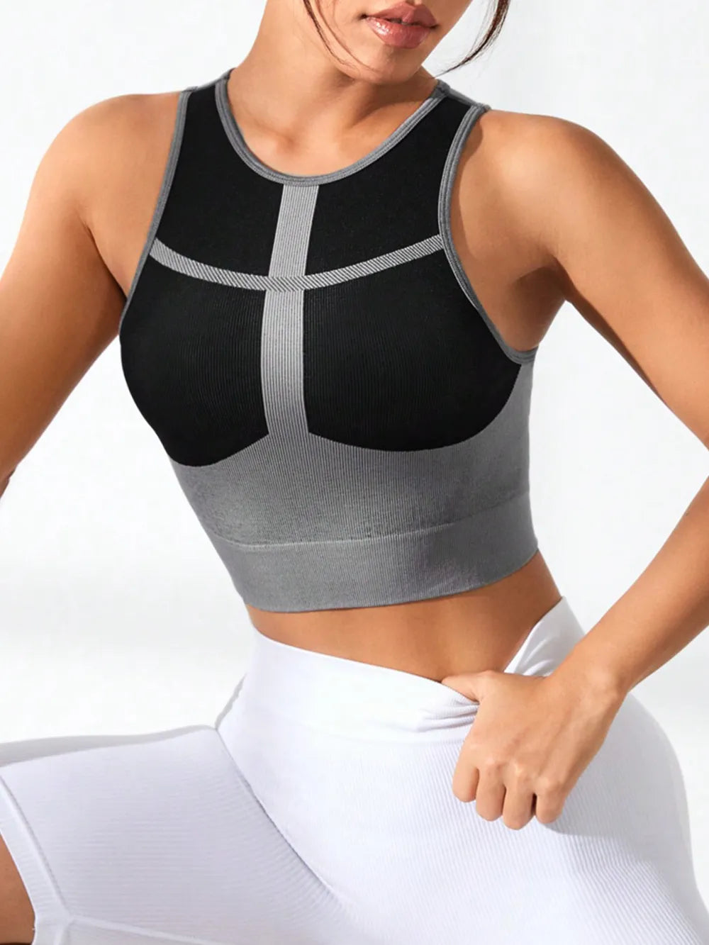 Woman wearing color block round neck active tank top

