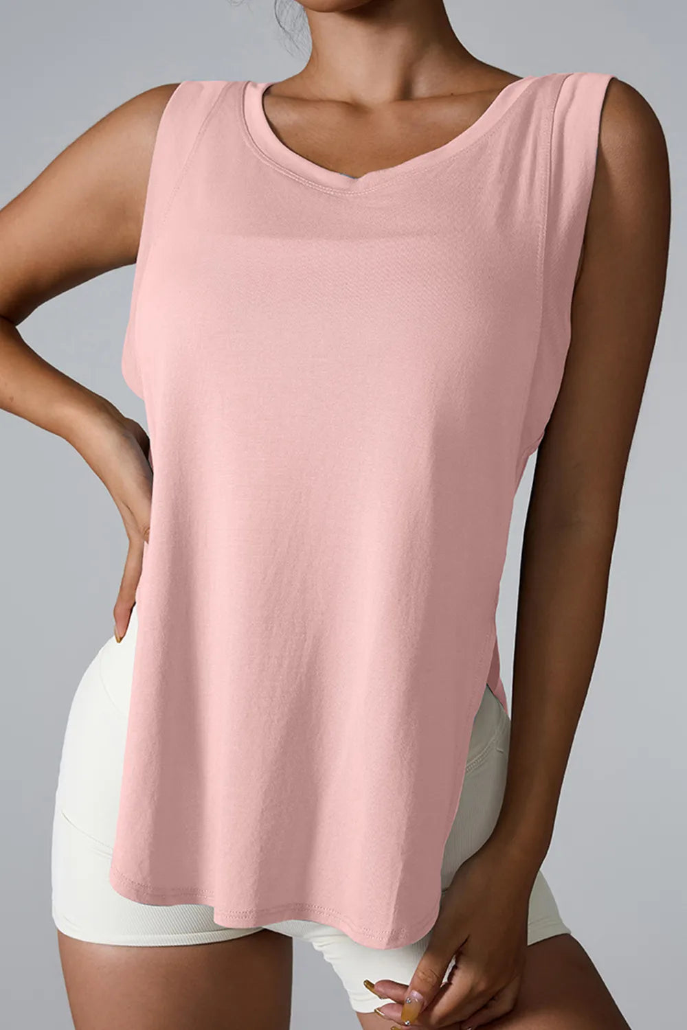 "Premium pink athletic tank with side slit detail for unrestricted movement"
RetryClaude can make mistakes. Please double-check responses.