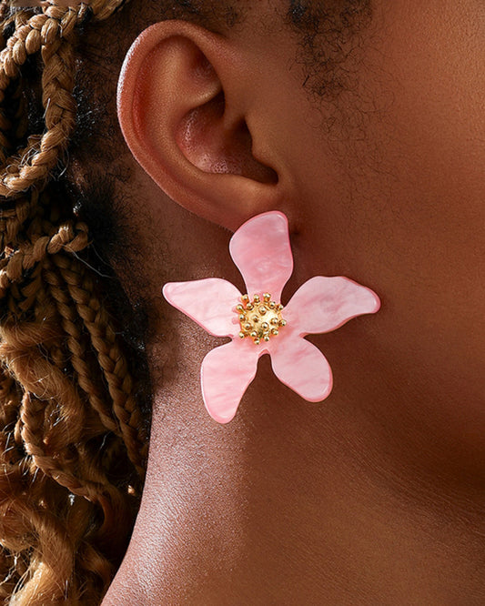 Model wearing cute flower earrings with summer outfit