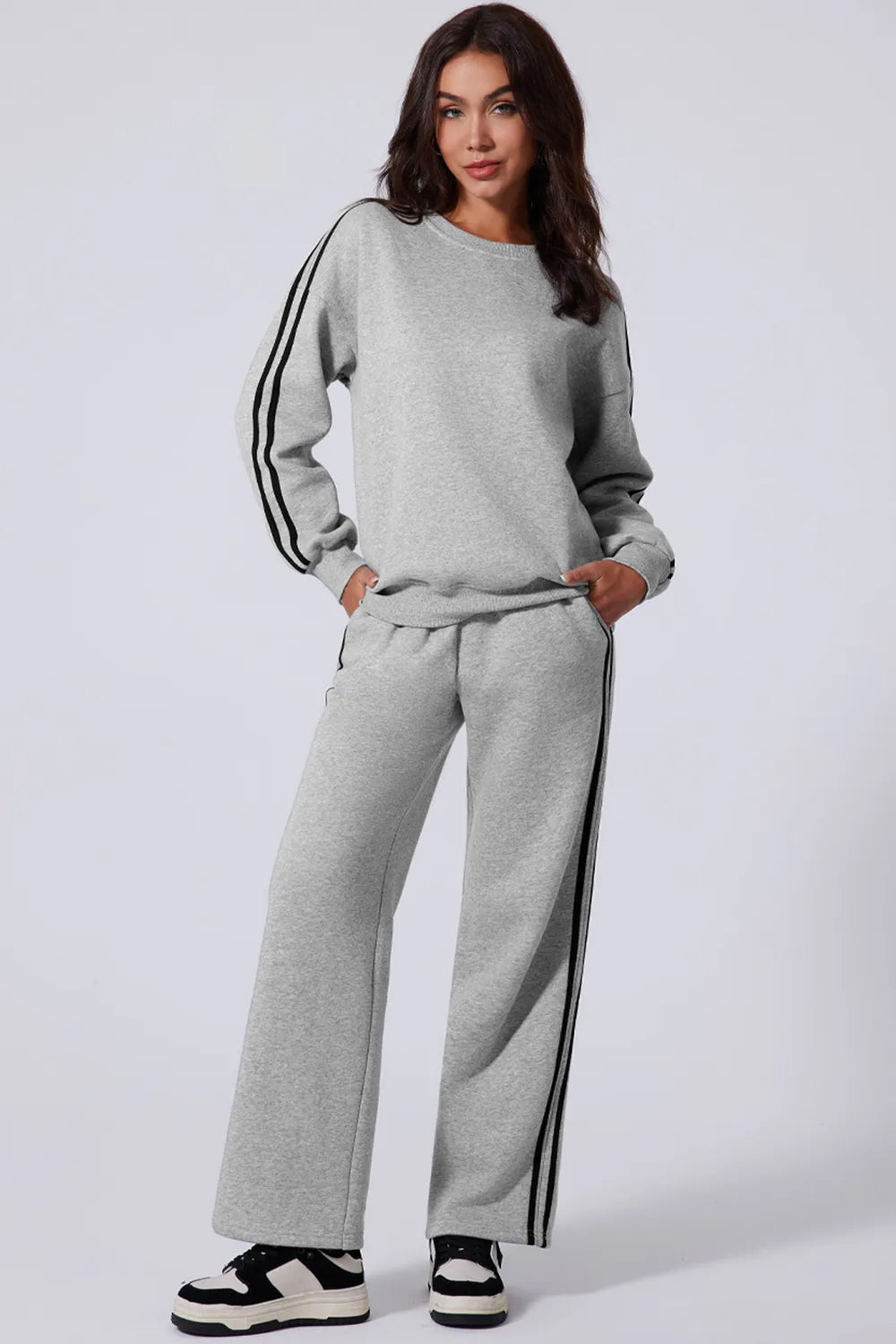 Model posing in motion to show flexibility of the outfit

