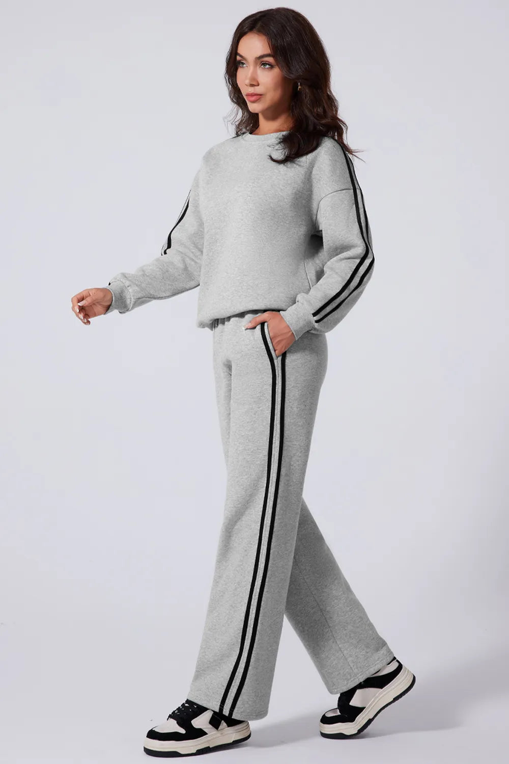 Side view highlighting the bold stripe on the pants

