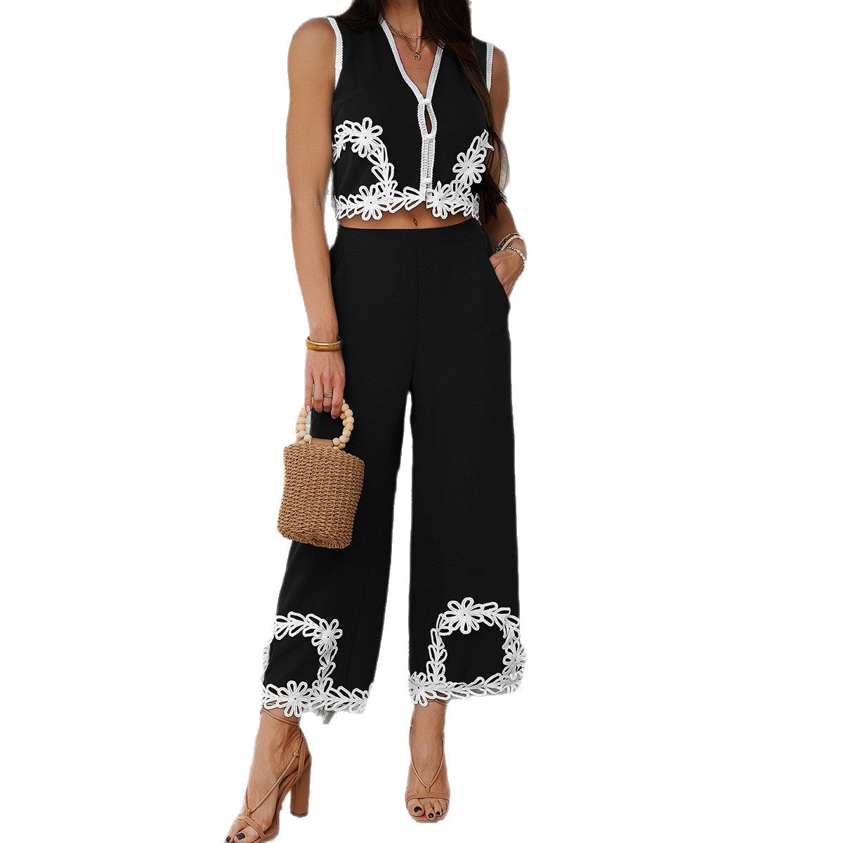 Back view of green pants set with white floral trim
