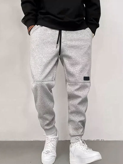 Men's new solid color casual cuff trousers