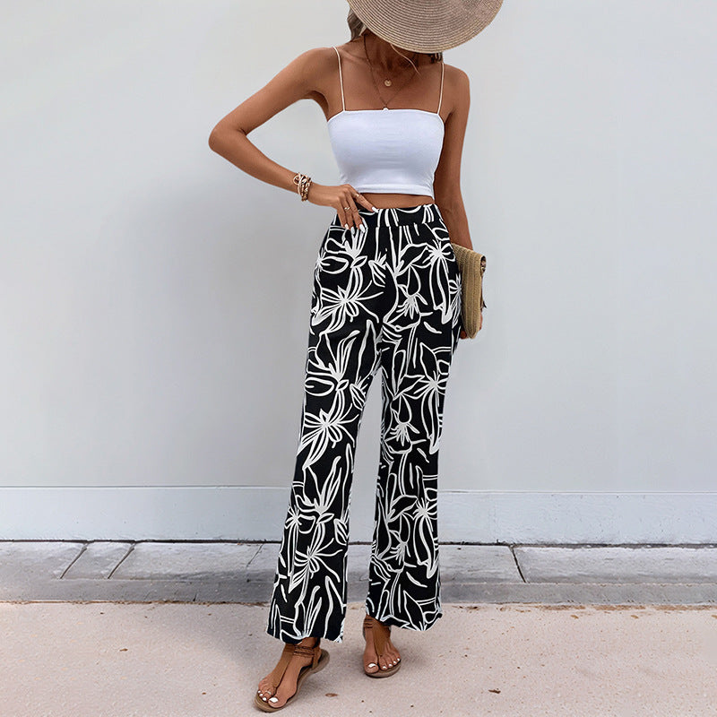 Palm and botanical print pants for beachwear
