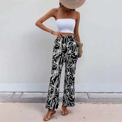 Palm and botanical print pants for beachwear
