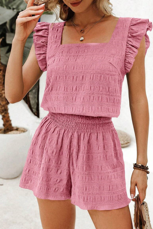 woman wearing pink textured two piece summer shorts set