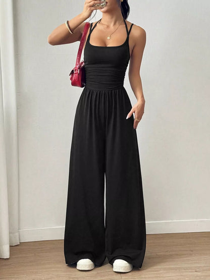 Women's black spaghetti strap wide leg jumpsuit with ruched waist detail
