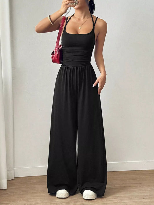 Women's black spaghetti strap wide leg jumpsuit with ruched waist detail
