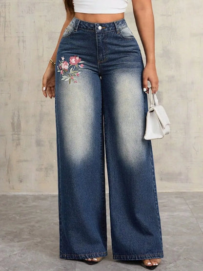 Women's dark blue washed high waist wide leg jeans with pink floral rose embroidery detail on hip
