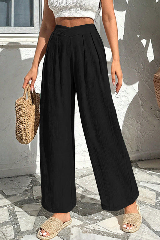 woman wearing high waist wide leg black casual pants